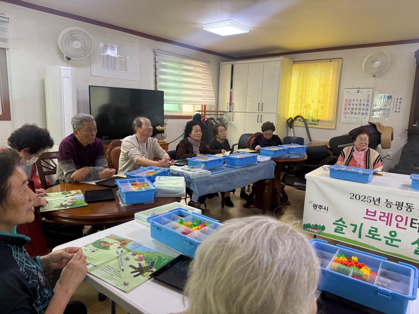 Seniors assembling robots at a senior center